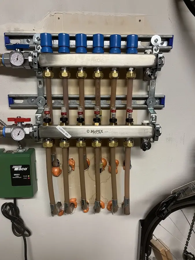 Plumber performing Water Heater Repair at a residential property in Crozet